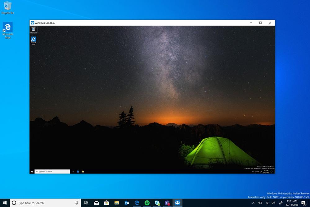 Showing a full screen desktop screenshot with a Windows Sandbox window open